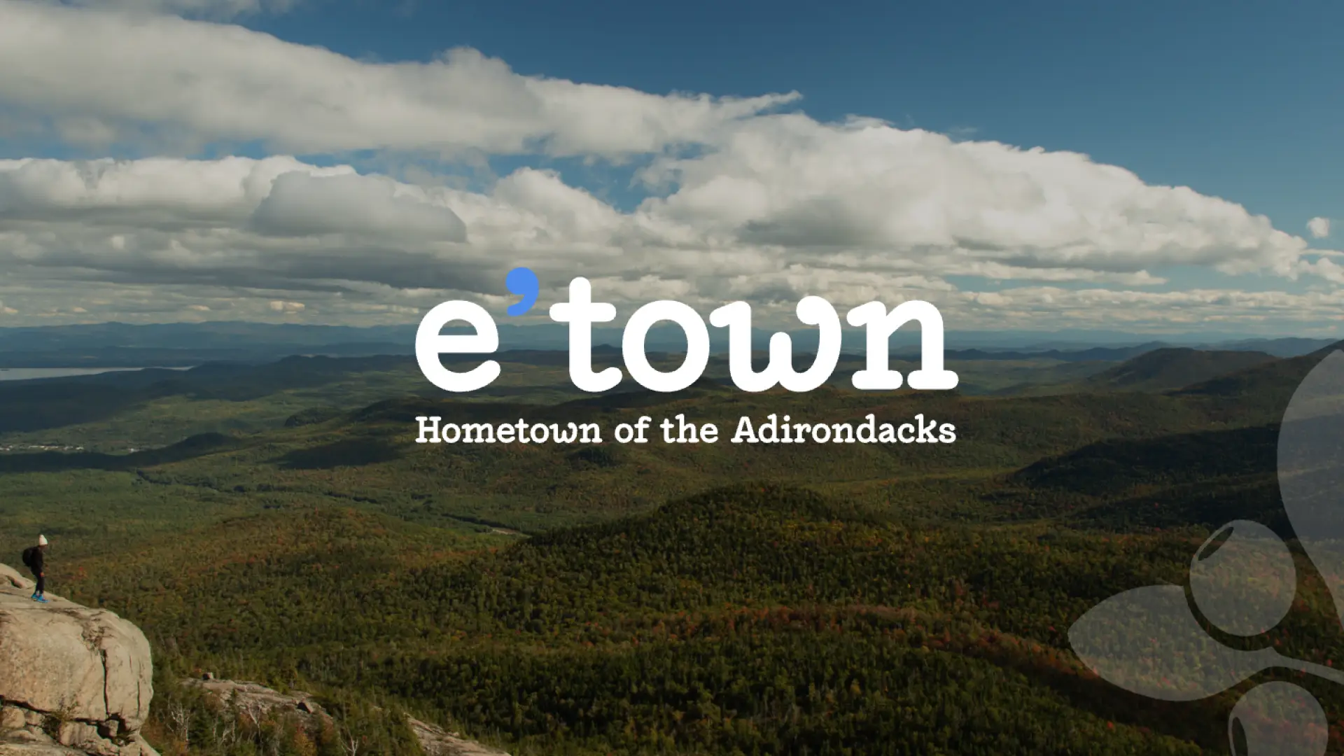 picture of mountains & our e'town logo with hometown of the adirondacks & blueberry logo